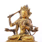 A serene gilt bronze statue of Manjusri with four arms