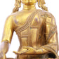 A solemn gilt bronze statue of Gautama Buddha