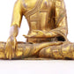 A solemn gilt bronze statue of Gautama Buddha