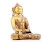 A solemn gilt bronze statue of Gautama Buddha