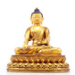 A solemn gilt bronze statue of Gautama Buddha