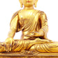 A solemn gilt bronze statue of Gautama Buddha