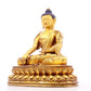 A solemn gilt bronze statue of Gautama Buddha