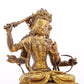 A serene gilt bronze statue of Manjusri with four arms