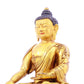 A solemn gilt bronze statue of Gautama Buddha