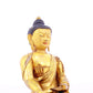 A solemn gilt bronze statue of Gautama Buddha