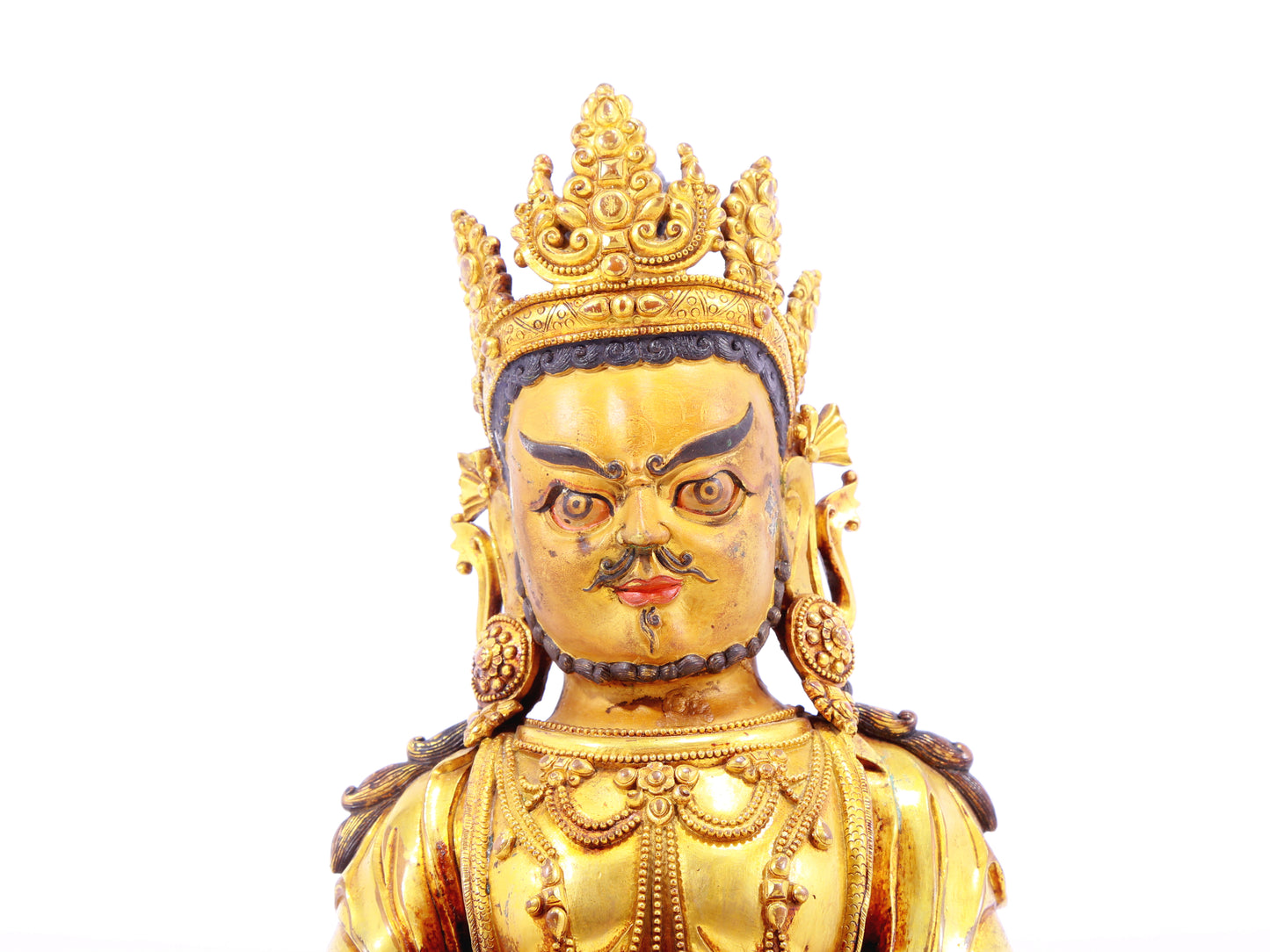 A solemn gilt bronze statue of the God of Wealth