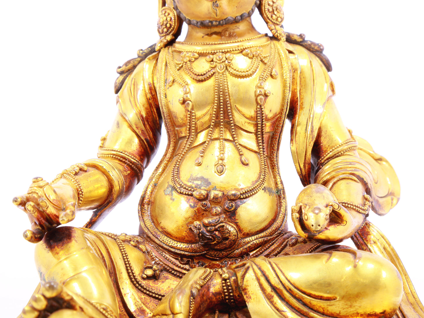 A solemn gilt bronze statue of the God of Wealth