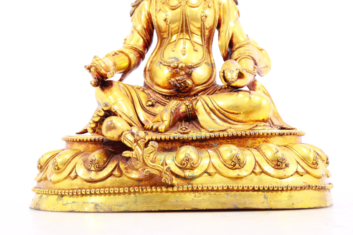 A solemn gilt bronze statue of the God of Wealth