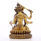 A serene gilt bronze statue of Manjusri with four arms