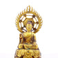 A solemn gilt bronze statue of Gautama Buddha