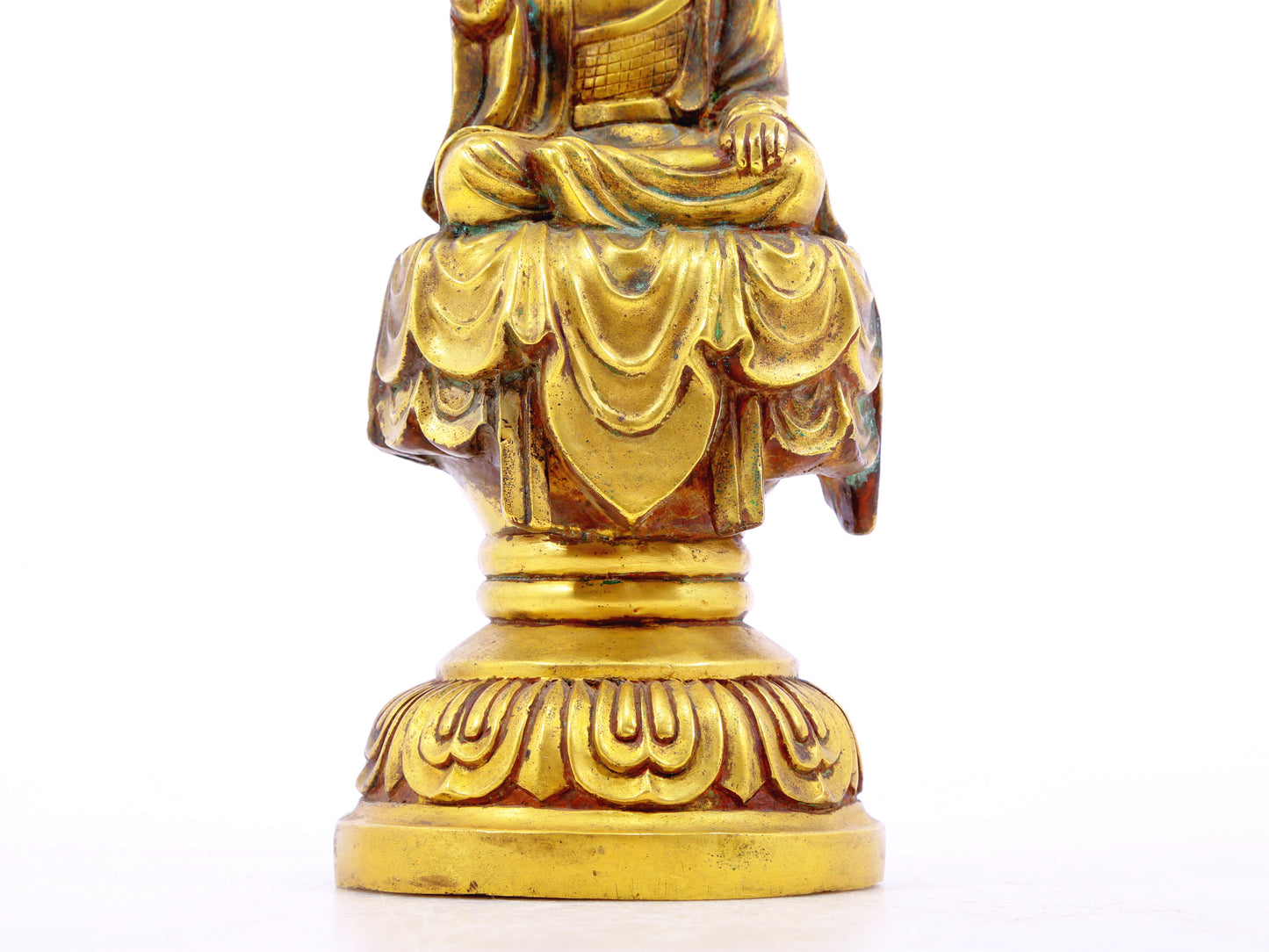 A solemn gilt bronze statue of Gautama Buddha