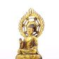 A solemn gilt bronze statue of Gautama Buddha