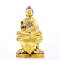 A solemn gilt bronze statue of Gautama Buddha