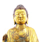 A solemn gilt bronze statue of Gautama Buddha