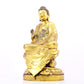 A solemn gilt bronze statue of Gautama Buddha