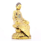 A solemn gilt bronze statue of Gautama Buddha