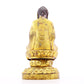 A solemn gilt bronze statue of Gautama Buddha