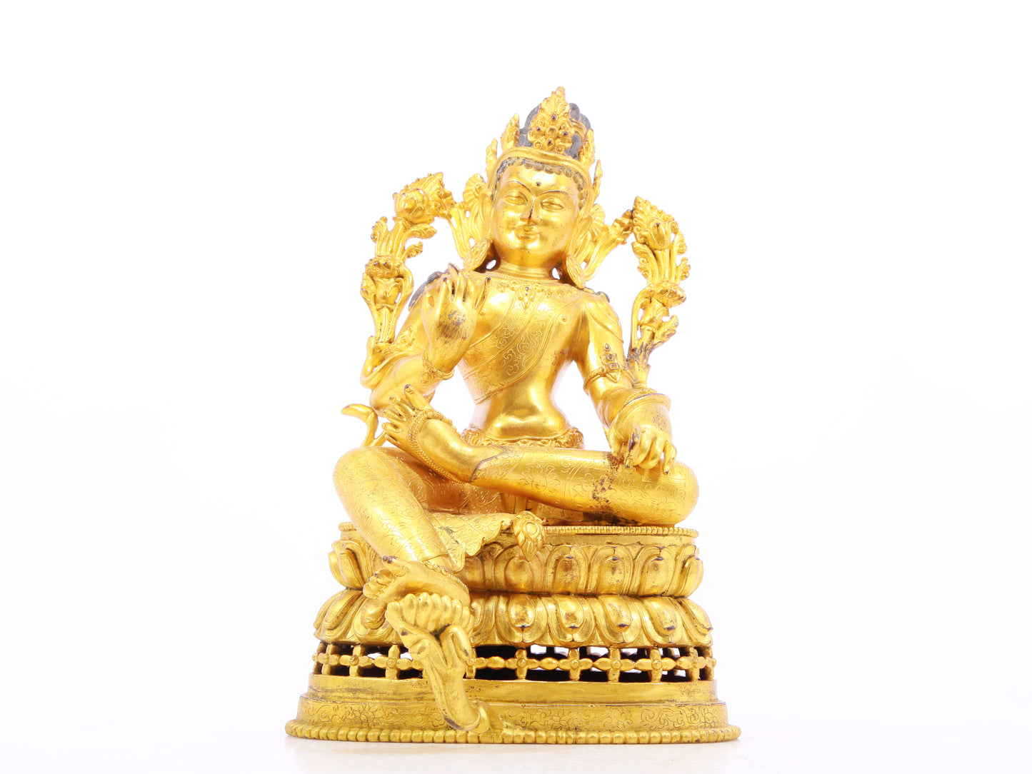 A solemn gilt bronze statue of green Tara