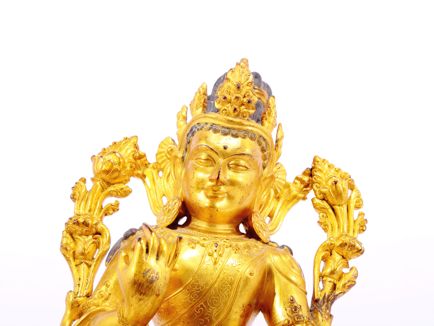 A solemn gilt bronze statue of green Tara