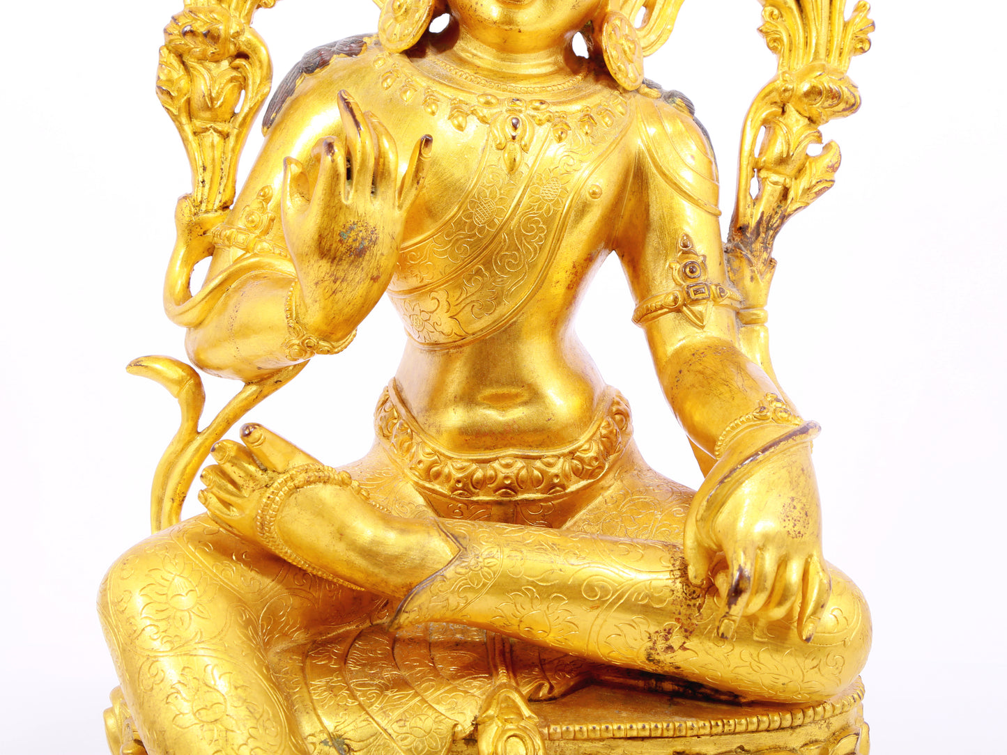 A solemn gilt bronze statue of green Tara