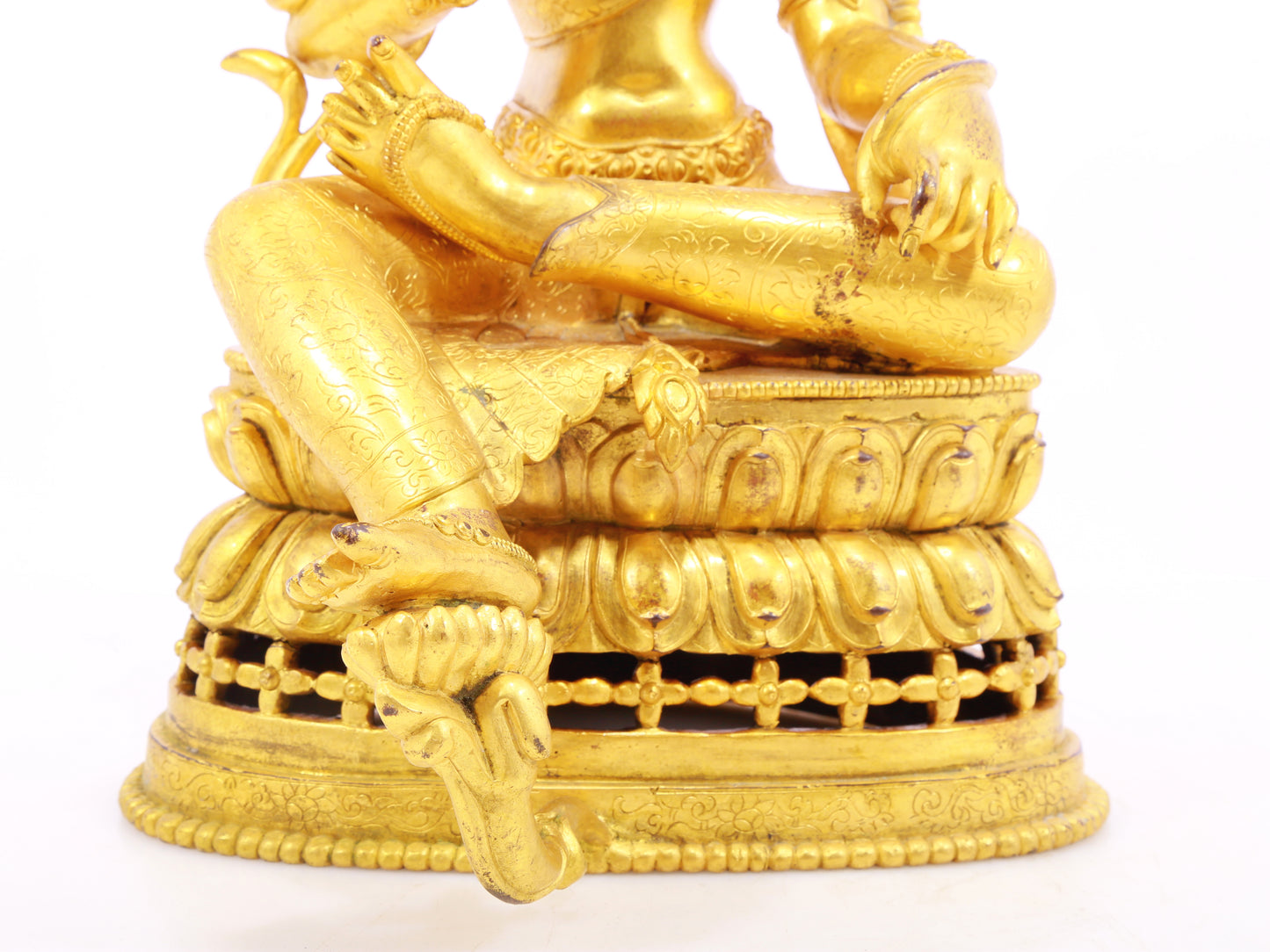 A solemn gilt bronze statue of green Tara