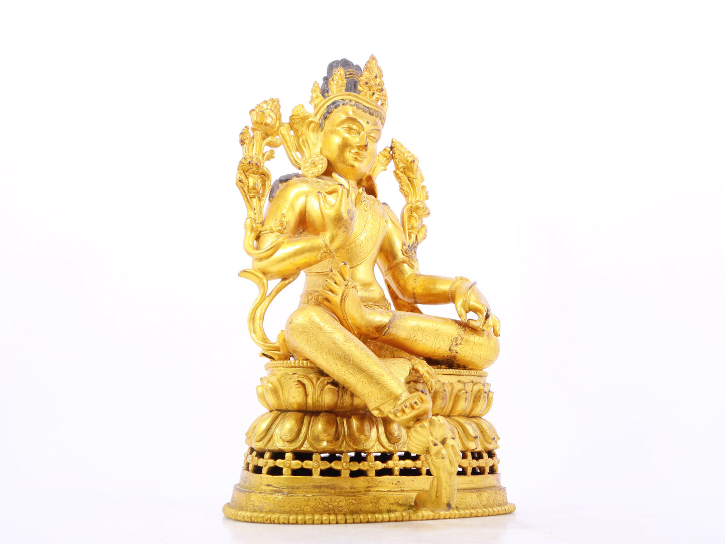 A solemn gilt bronze statue of green Tara