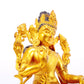 A solemn gilt bronze statue of green Tara