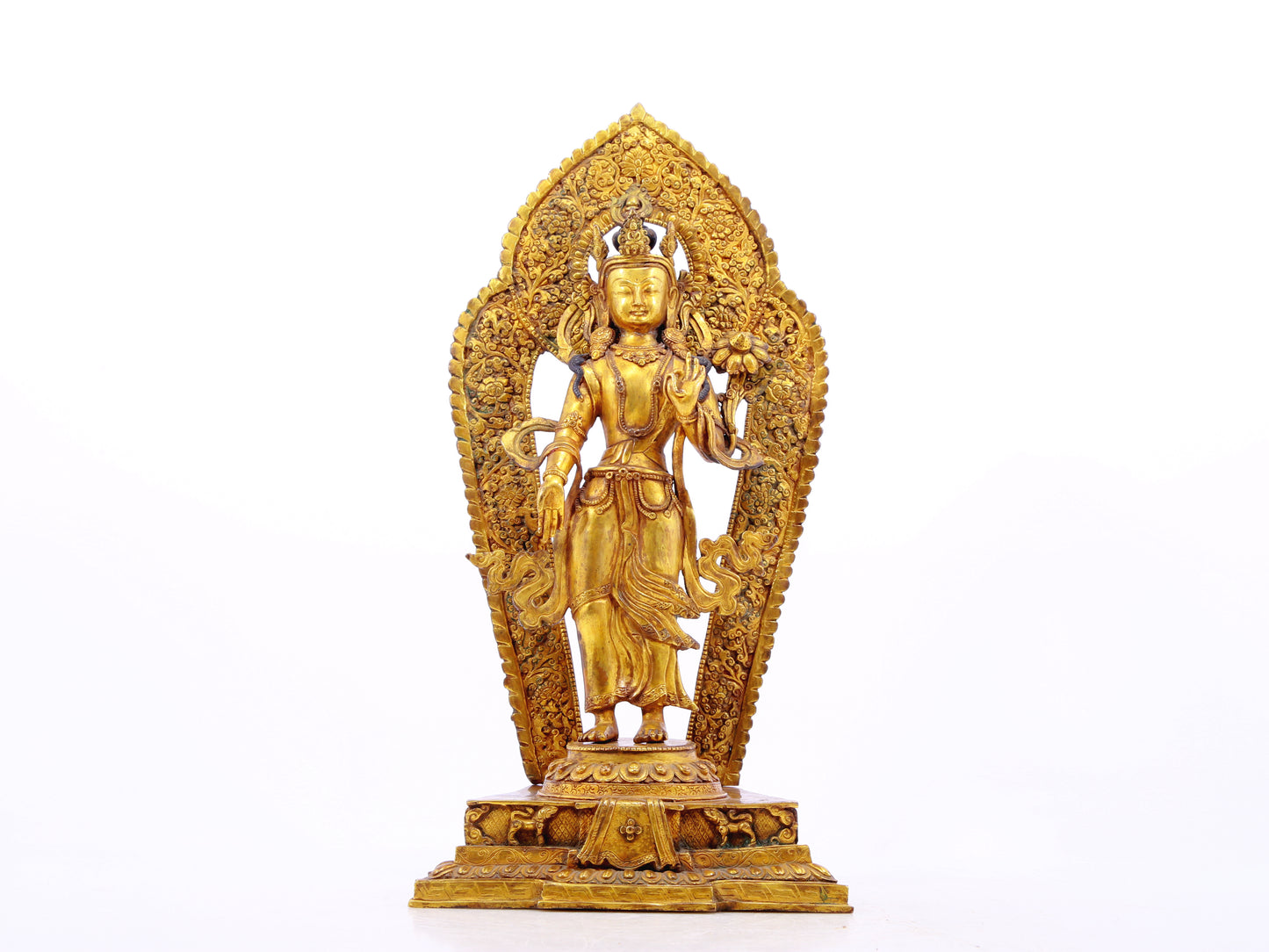 A solemn gilt bronze statue of Tara