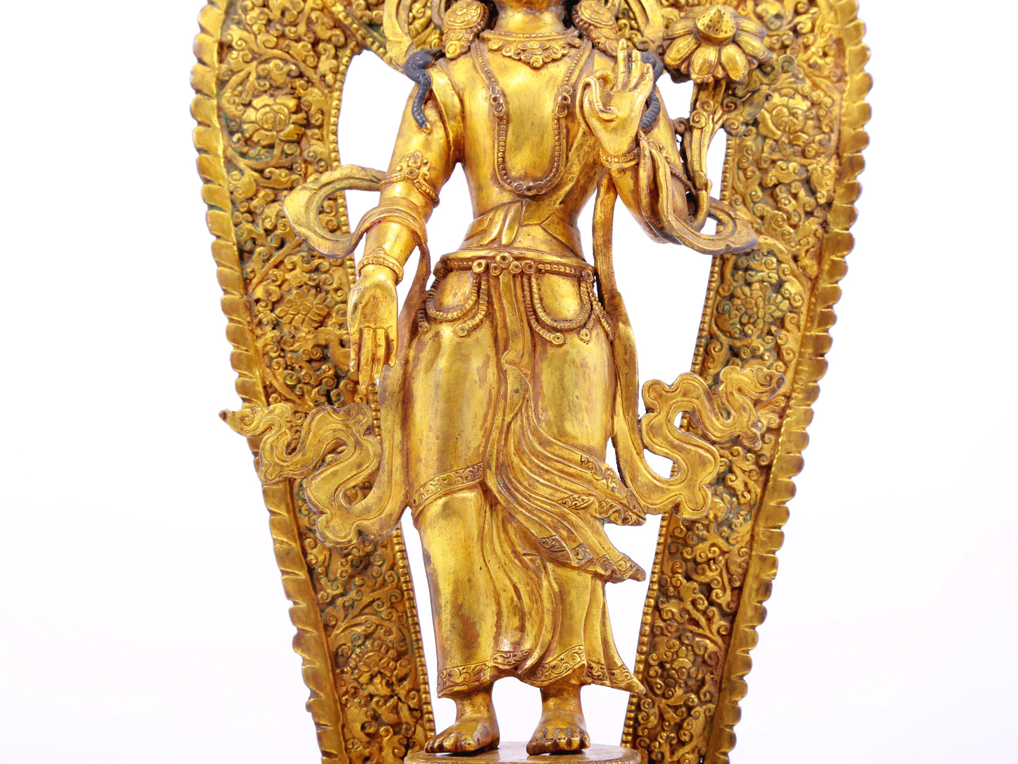 A solemn gilt bronze statue of Tara