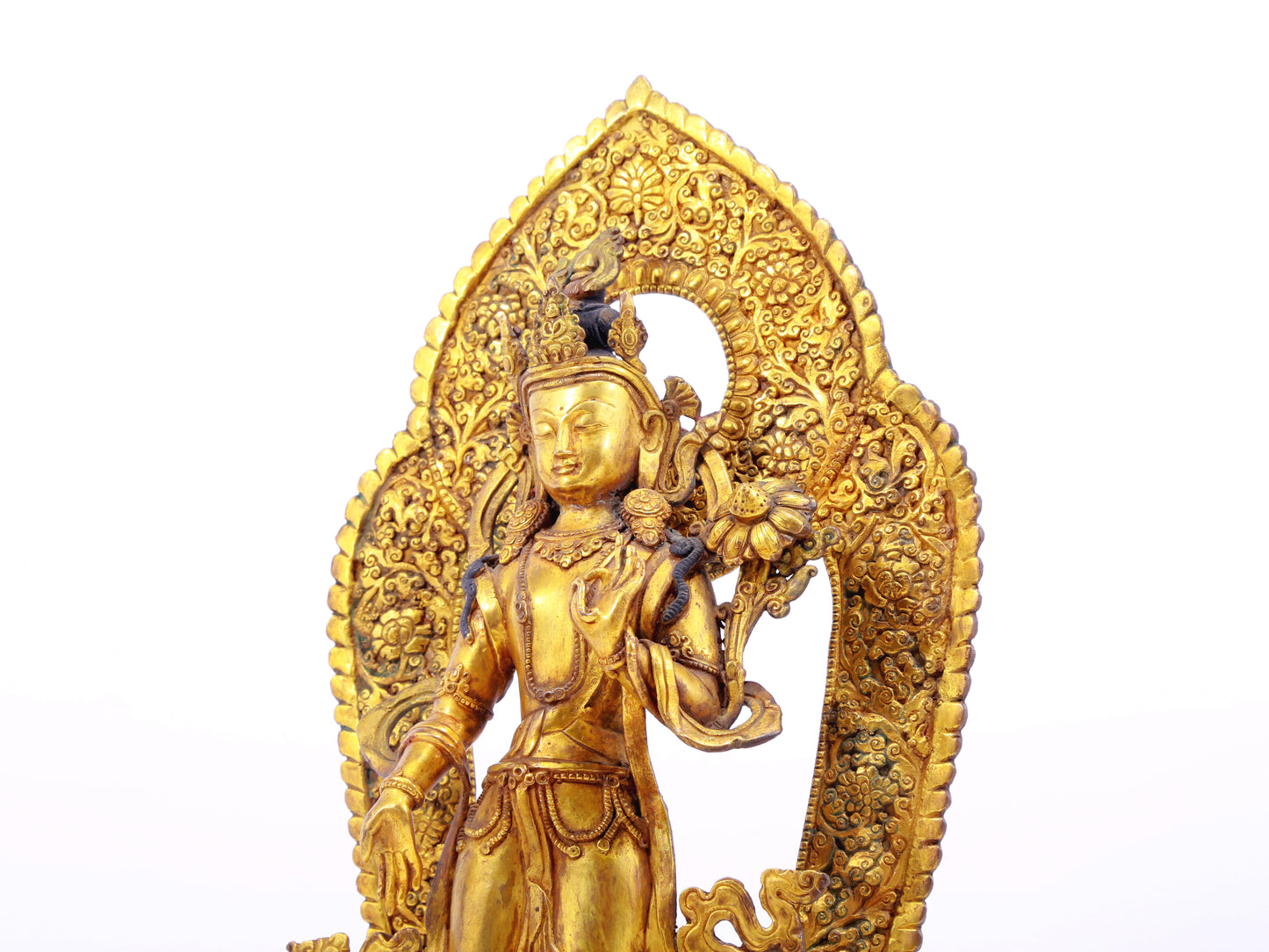 A solemn gilt bronze statue of Tara