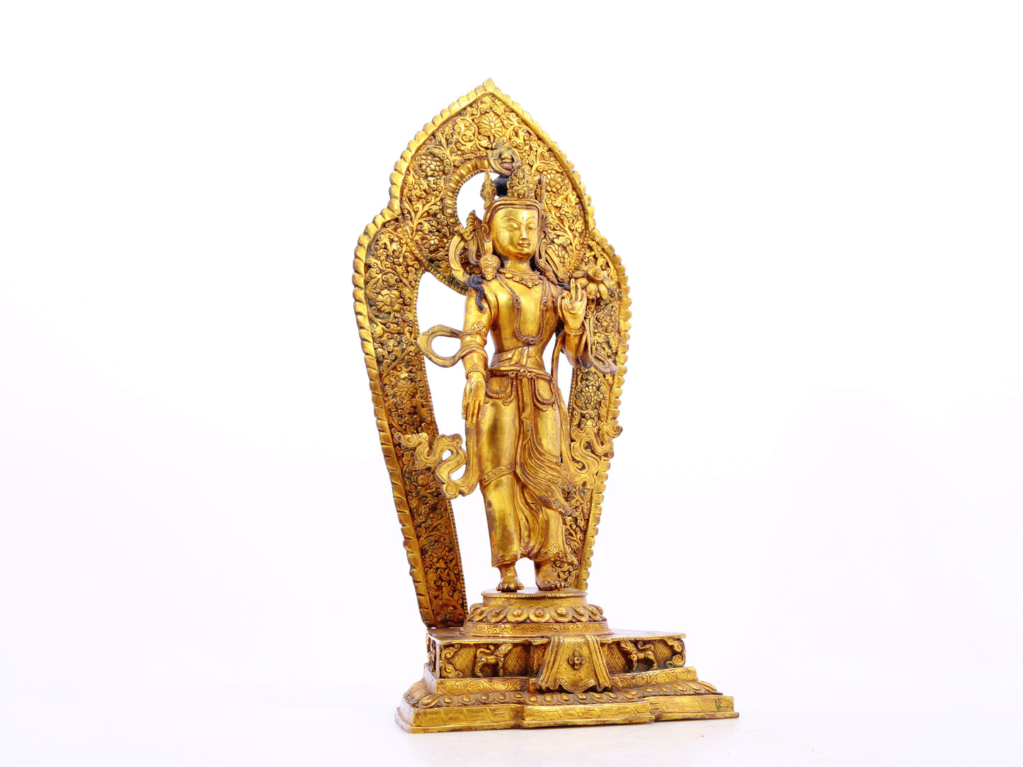 A solemn gilt bronze statue of Tara