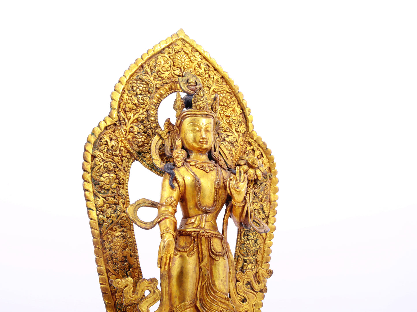 A solemn gilt bronze statue of Tara