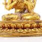 A serene gilt bronze statue of Gautama Buddha