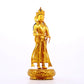 A solemn gilt bronze Bodhisattva stands