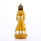 A solemn gilt bronze Bodhisattva stands