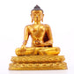 A solemn gilt bronze statue of Gautama Buddha