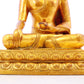 A solemn gilt bronze statue of Gautama Buddha