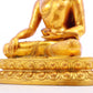 A solemn gilt bronze statue of Gautama Buddha