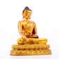 A solemn gilt bronze statue of Gautama Buddha