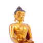 A solemn gilt bronze statue of Gautama Buddha