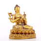 A serene gilt bronze statue of Gautama Buddha