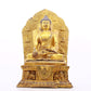 A solemn gilt bronze statue of Gautama Buddha