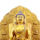 A solemn gilt bronze statue of Gautama Buddha