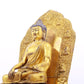 A solemn gilt bronze statue of Gautama Buddha