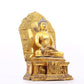 A solemn gilt bronze statue of Gautama Buddha