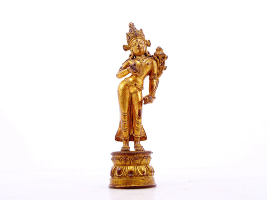 A serene gilt bronze statue of Tara