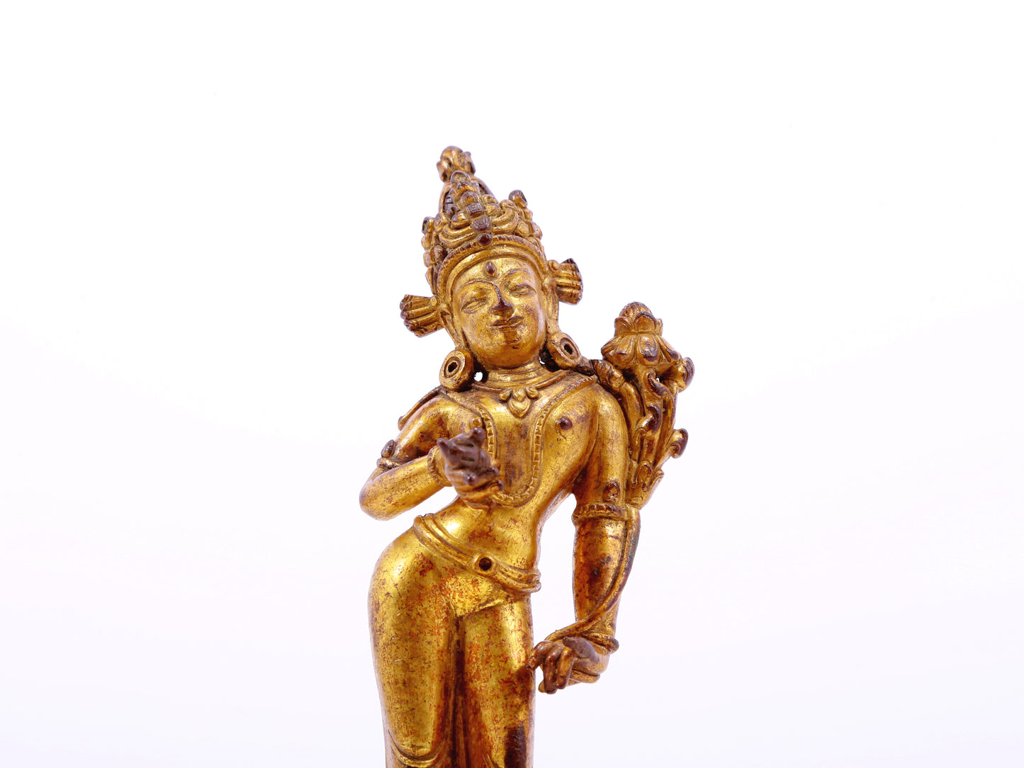 A serene gilt bronze statue of Tara