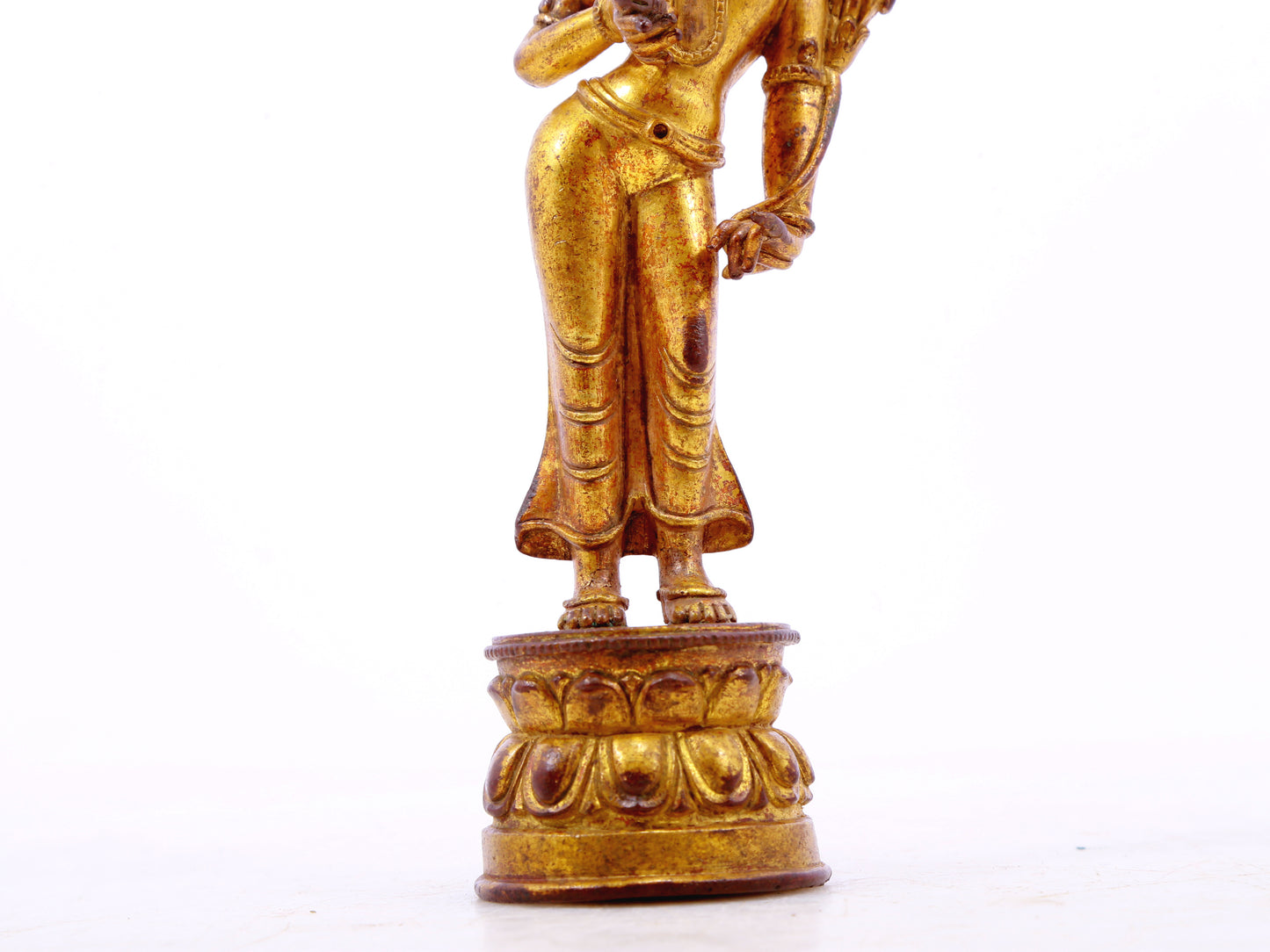 A serene gilt bronze statue of Tara