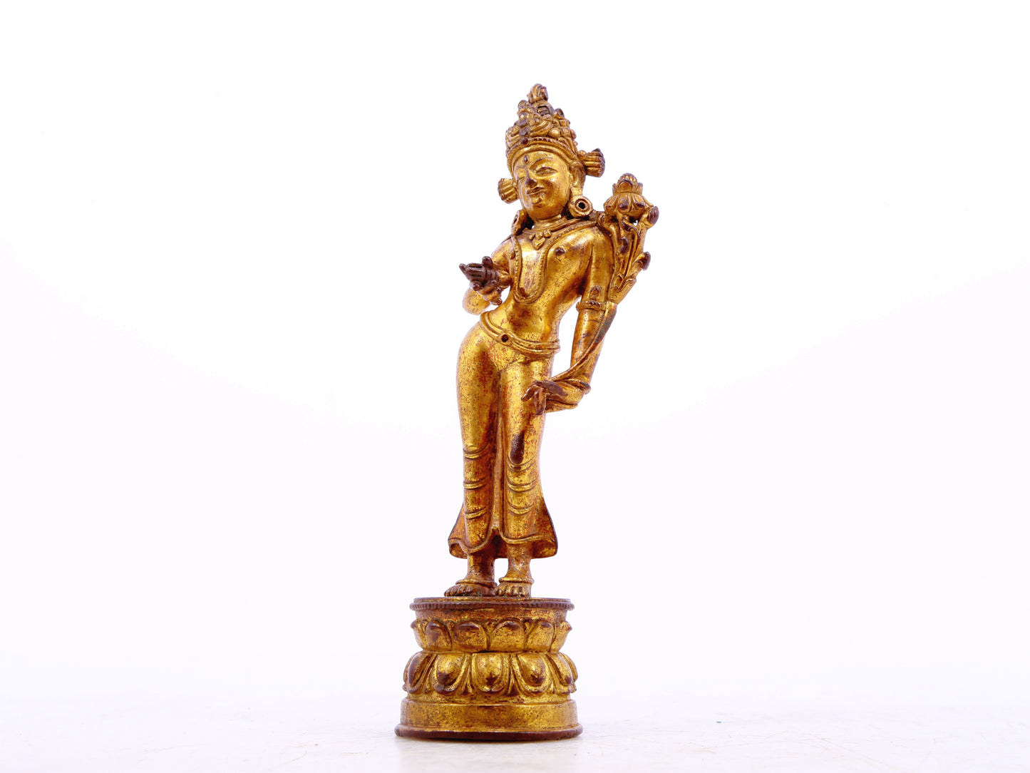 A serene gilt bronze statue of Tara